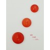 Botón rojo con brillo semitransparente